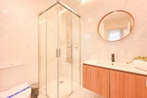 a bathroom with a shower and a sink and a mirror at FindMe InPorto Bonfim in Porto