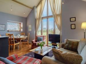 a living room with a couch and a table at 2 Bed in Radstock oc-00452 in Binegar