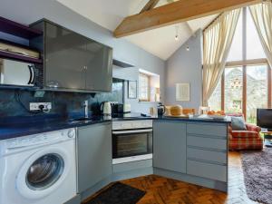 a kitchen with a washer and dryer at 2 Bed in Radstock oc-00452 in Binegar +12 photos