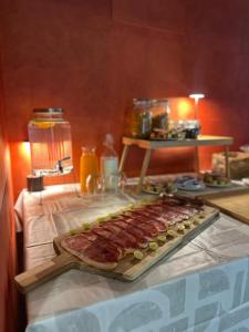 a tray of meat on top of a table at Aguas de Ibias in Cecos