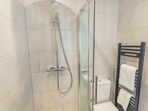 a bathroom with a glass shower with a toilet at 2 Bed in York oc-84001 in Crayke +10 photos