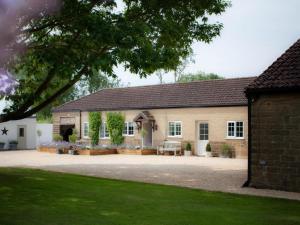 an exterior view of a house with a courtyard at 2 Bed in York oc-84001 in Crayke