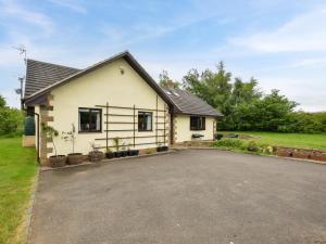 a house with a driveway in front of it at 4 Bed in Morpeth oc-86132 in Warkworth