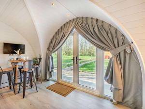 a room with a large glass door with a table and chairs at 1 Bed in Consett oc-87934 in Shotley Bridge