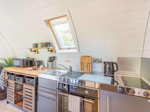 a kitchen with a sink and a stove top oven at 1 Bed in Consett oc-87934 in Shotley Bridge +9 photos