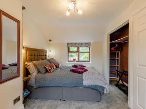 a bedroom with a large bed and a window at 2 Bed in Ripon oc-88051 in Ripon