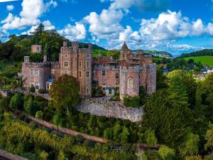 an old castle on a hill with trees at 1 Bed in Dulverton oc-lbard in Dulverton