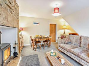 a living room with a couch and a table at 2 Bed in Hexham oc-50500 in Bellingham