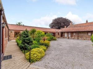 an exterior view of a house with a courtyard at 3 Bed in York oc-83264 in High Catton