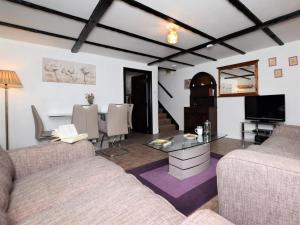a living room with two couches and a table at 2 Bed in Bridgwater oc-alden in Kilve +13 photos