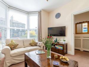 a living room with a couch and a tv at 3 Bed in Harrogate oc-hh056 in Harrogate