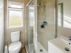a bathroom with a toilet and a shower and a sink at 2 Bed in Bridlington oc-79429 in Sewerby +8 photos