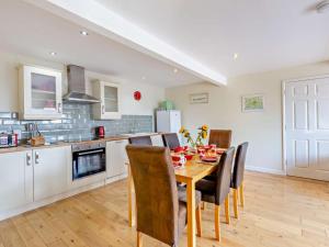 a kitchen and dining room with a table and chairs at 3 Bed in Yeovil oc-htorv in Castle Cary