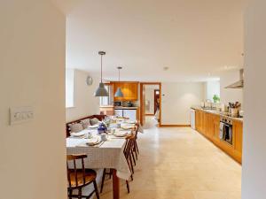 a kitchen and dining room with a table and chairs at 4 Bed in Frome oc-27808 in Holwell
