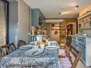 a kitchen with a table with plates on it at 3 Bed in Montacute oc-92227 in Montacute