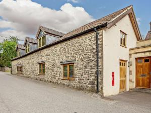 a stone building with windows and a door at 4 Bed in Frome oc-27808 in Holwell
