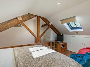 a bedroom with a large bed and a window at 3 Bed in Montacute oc-92227 in Montacute