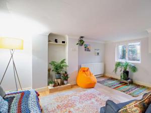 a living room with a couch and potted plants at 3 Bed in Ripon oc-94477 in Ripon