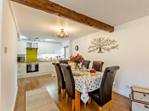 a kitchen and dining room with a table and chairs at 2 Bed in Driffield oc-79280 in Wold Newton