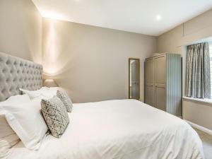 a bedroom with a white bed and a window at 2 Bed in York oc-84000 in Crayke