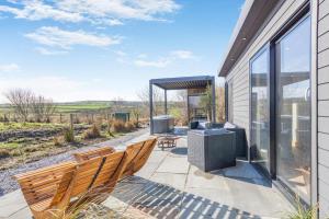 a patio with chairs and a gazebo at 1 Bed in Austwick oc-b37509 in Austwick
