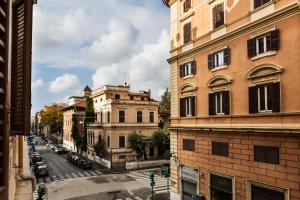 a view of a city street with buildings and cars at LaHouse Rome by Premium Suites Collection in Rome