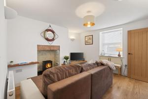 a living room with a couch and a fireplace at 2 Bed in Aberystwyth oc-c36918 in Aberystwyth