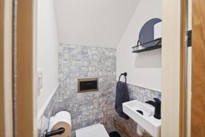 a small bathroom with a sink and a toilet at 2 Bed in Aberystwyth oc-c36918 in Aberystwyth +23 photos