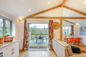 a kitchen and living room with a table and chairs at 3 Bed in Winnards Perch oc-m30557 in Saint Columb Major