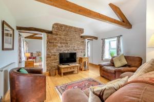a living room with a couch and a tv at 3 Bed in Scaleby oc-b33069 in Scaleby