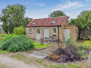 an old stone house with a red roof at 1 Bed in Pickering oc-96309 in Allerston