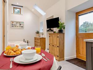 a table with a plate of food on it at 1 Bed in Pickering oc-96309 in Allerston
