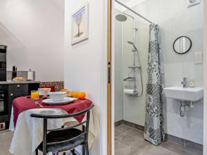 a bathroom with a table and a sink and a shower at 1 Bed in Pickering oc-96309 in Allerston +12 photos