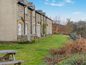 a building with a picnic table in front of it at 2 Bed in Consett oc-96375 in Hunstanworth