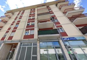 a tall building with many windows on it at Casa Martinez Relax Cles in Cles