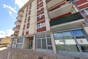 a large building with a lot of windows at Casa Martinez Relax Cles in Cles