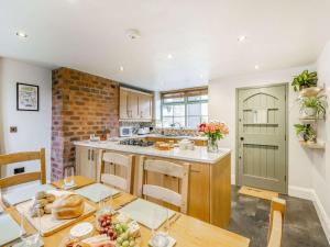 a kitchen with a table and a counter top at 3 Bed in Keighley oc-89528 in Haworth