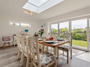 a dining room and kitchen with a table and chairs at 4 Bed in Wareham oc-77511 in Stoborough