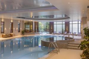 a large swimming pool in a hotel lobby at The Gleneagles Hotel in Auchterarder
