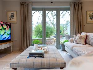 a living room with a couch and a tv at 1 Bed in Ripon oc-95074 in Dishforth