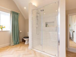 a bathroom with a shower and a toilet at 1 Bed in Ripon oc-95074 in Dishforth +21 photos