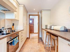 a kitchen with white cabinets and a counter top at 1 Bed in Southampton oc-92943 in Chalbury +11 photos