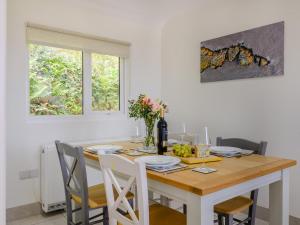 a dining room with a wooden table and chairs at 2 Bed in Weston-super-mare oc-94385 in Worle