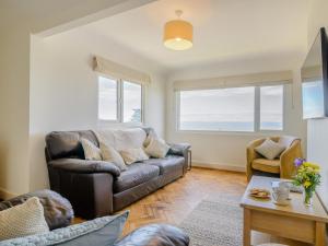 a living room with a couch and a table at 2 Bed in Weston-super-mare oc-94385 in Worle