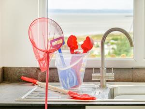 a kitchen counter with a kitchen utensils in a sink at 2 Bed in Weston-super-mare oc-94385 in Worle +18 photos