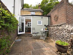 a patio of a house with a brick wall at 2 Bed in Dorchester oc-66192 in Stratton