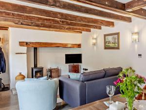 a living room with a couch and a fireplace at 1 Bed in Bristol oc-95178 in Blagdon
