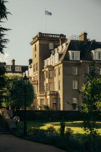 a large building with a flag on top of it at The Gleneagles Hotel in Auchterarder