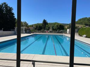 a swimming pool seen through a window at Oustal de Bourdeaux in Bourdeaux +28 photos