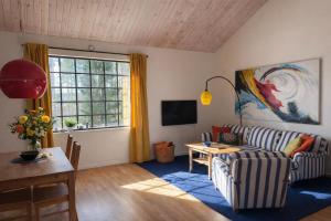 a living room with a couch and a table at The Studio in Skellefteå